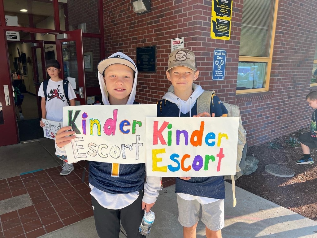 Students volunteered to escort our new kinders to class